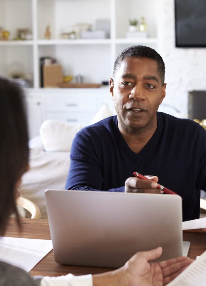 man-with-laptop-computer-giving-financial-advice-EXHCZMG
