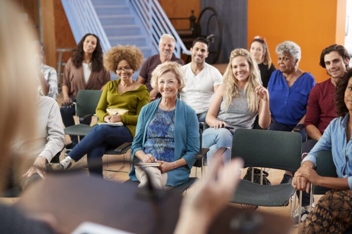 group-attending-neighborhood-meeting-listening-to-2024-10-19-04-42-36-utc